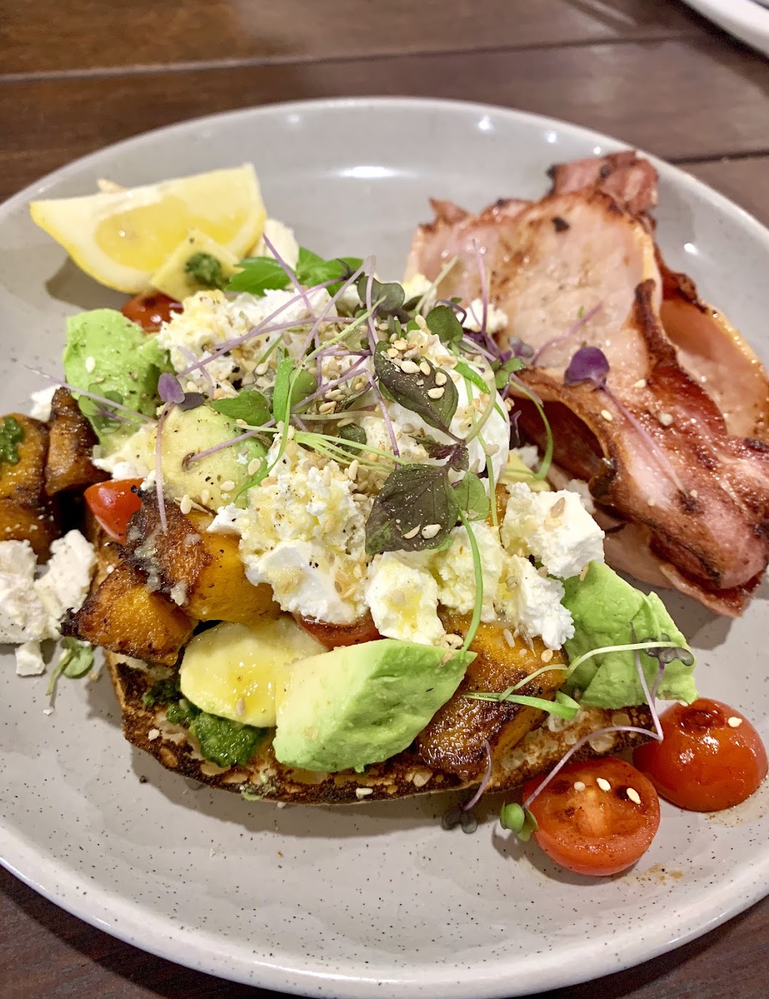 Pumpkin and feta bruschetta with avocado, bacon and micro herbs